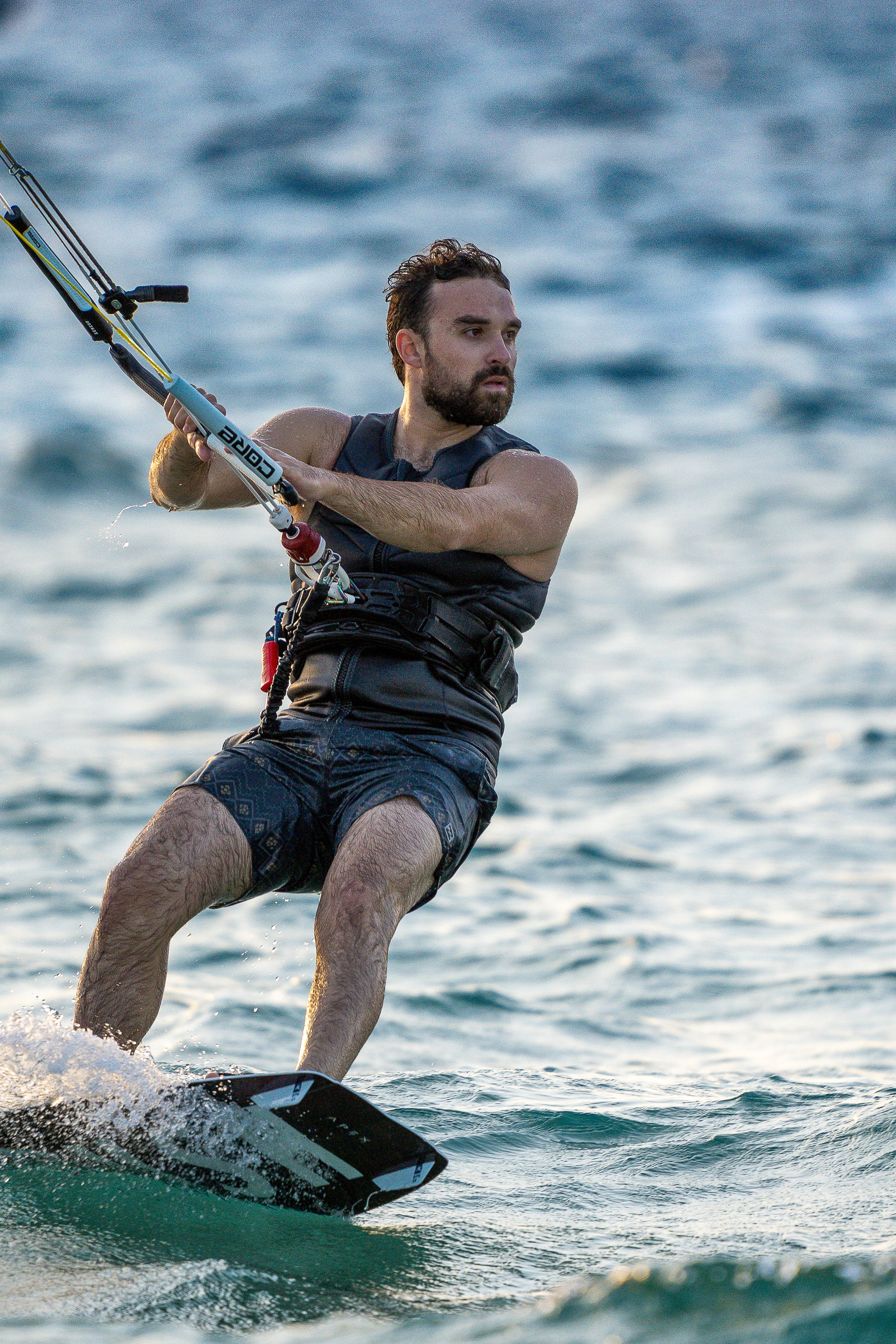 Kitesurfer carving hard on the edge