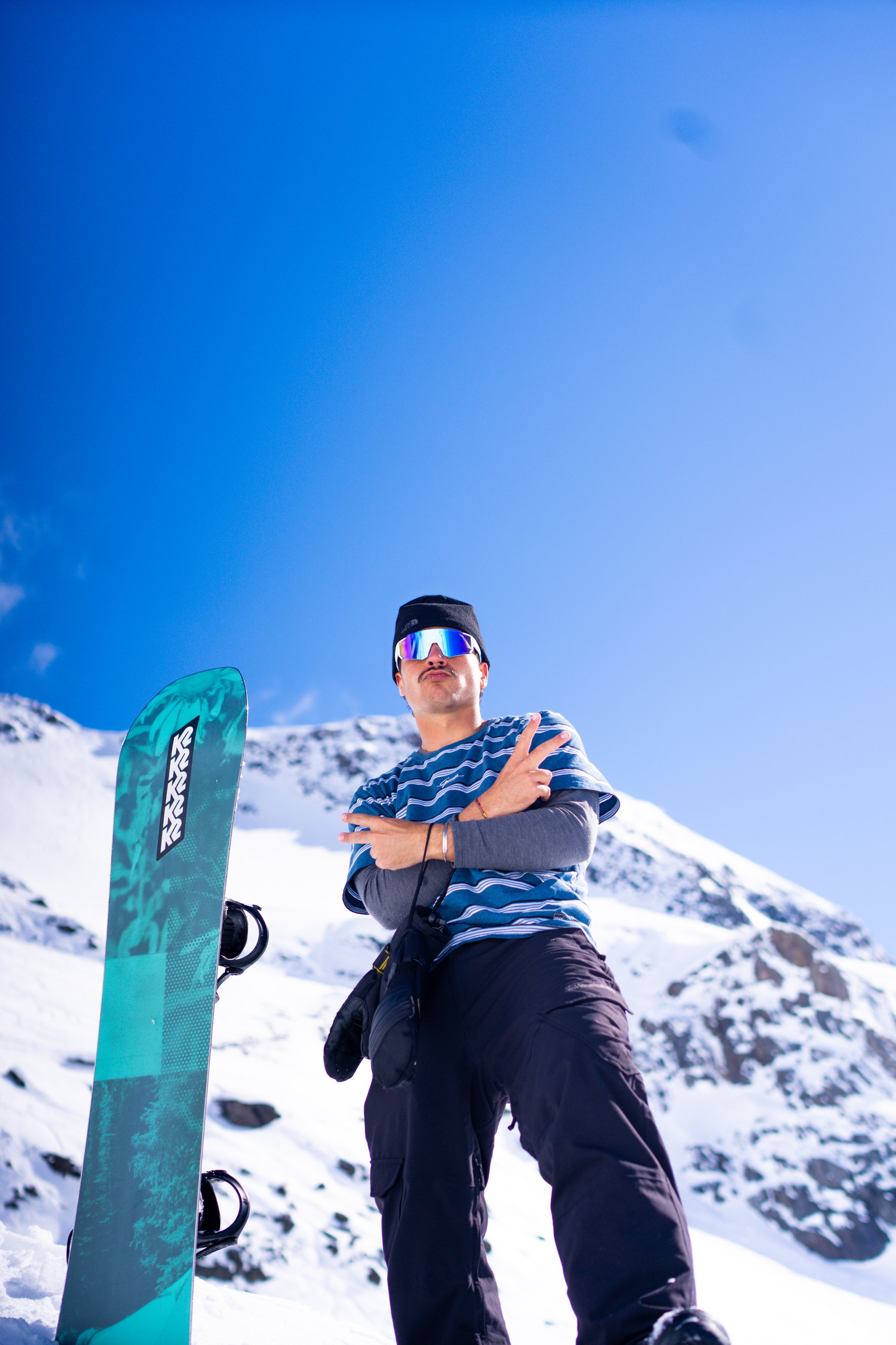 Snowboarder on the ridge before a run